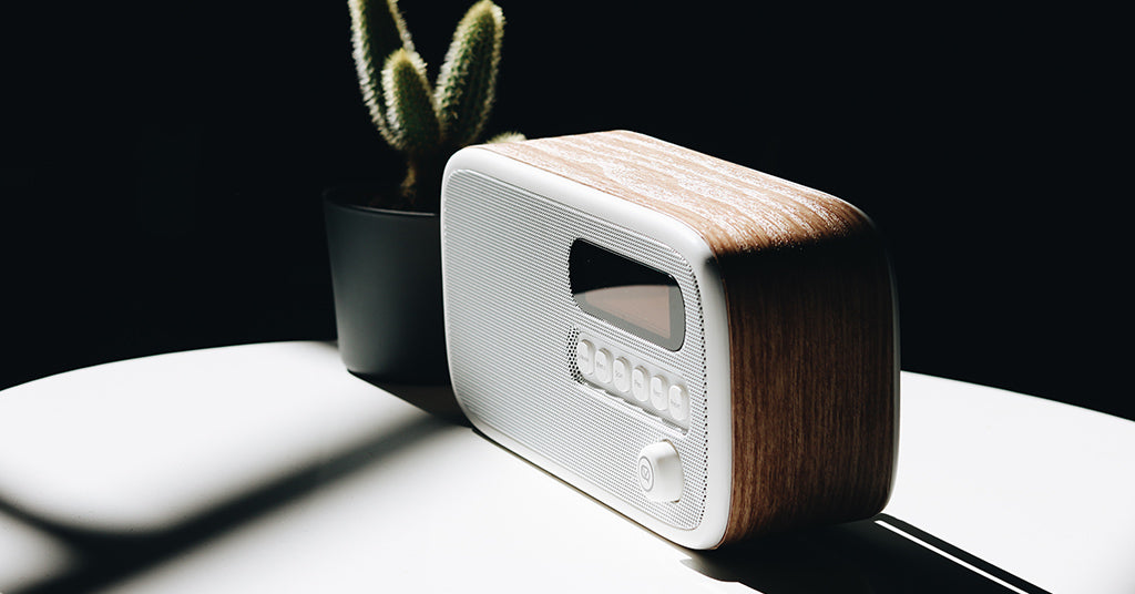 VQ Dexter DAB radio on white table next to miniature cactus