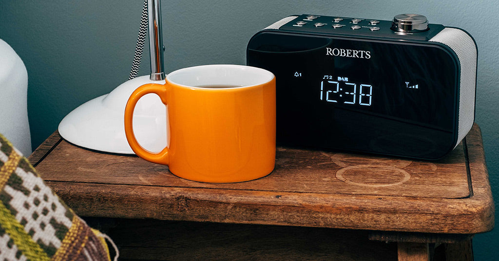Roberts Ortus 2 radio on bedside table with orange mug