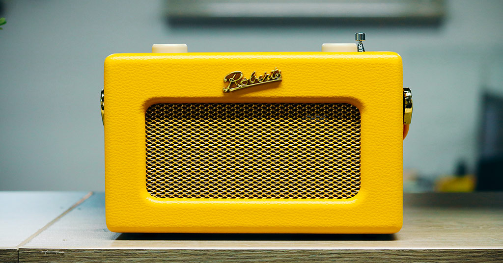 Yellow Roberts Revival Uno BT radio on shelf