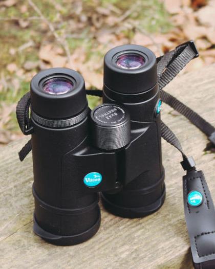 Viking binoculars sitting on wooden bench
